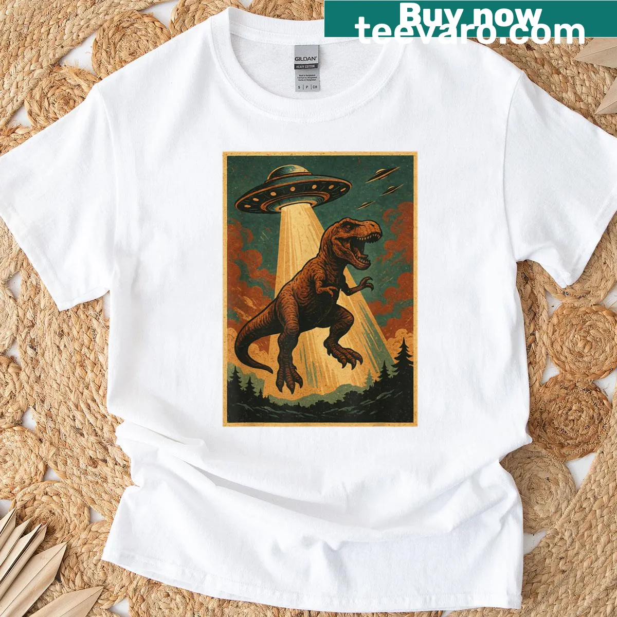 Playful illustration of a T-rex being abducted by a UFO on T-shirt — on a men's t-shirt