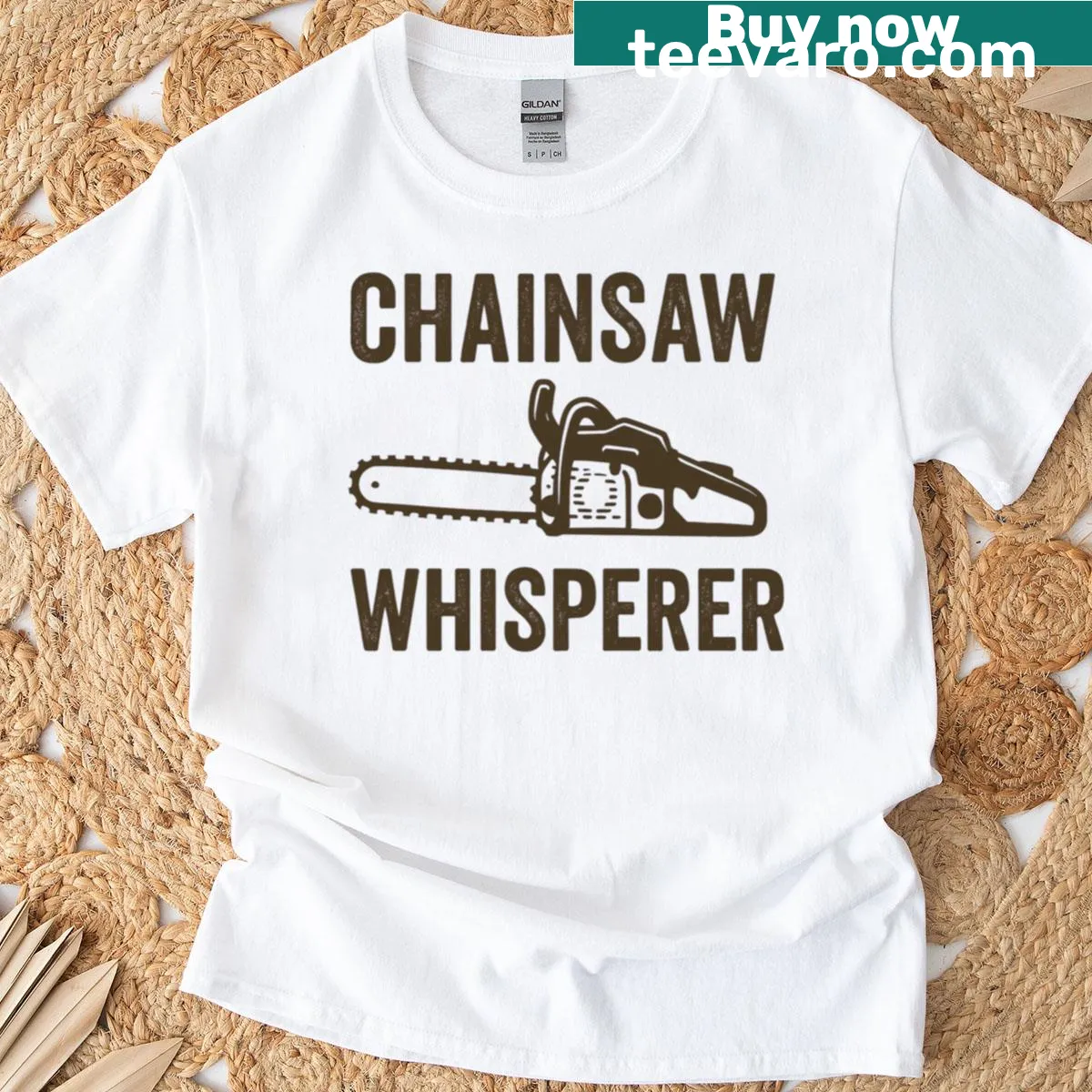 Oversized T-shirt with 'Chainsaw Whisperer' humorous text — on a men's t-shirt