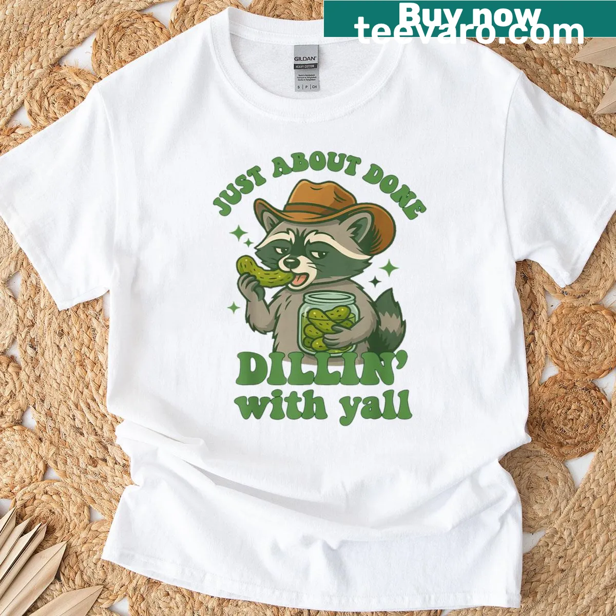 Cartoon raccoon cowboy with a pickle on a themed T-shirt — on a men's t-shirt