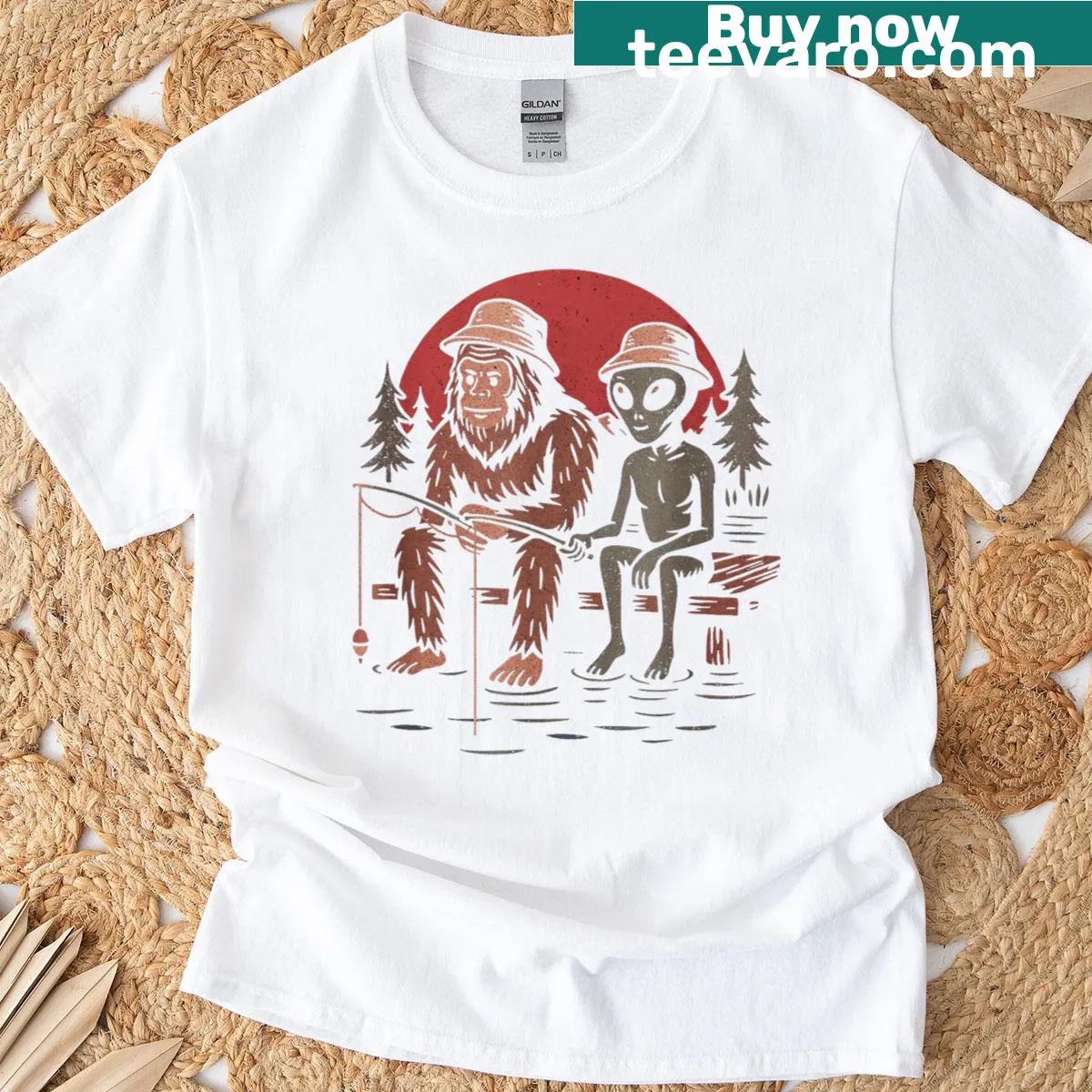 Distressed design featuring Bigfoot fishing in nature. — on a men's t-shirt