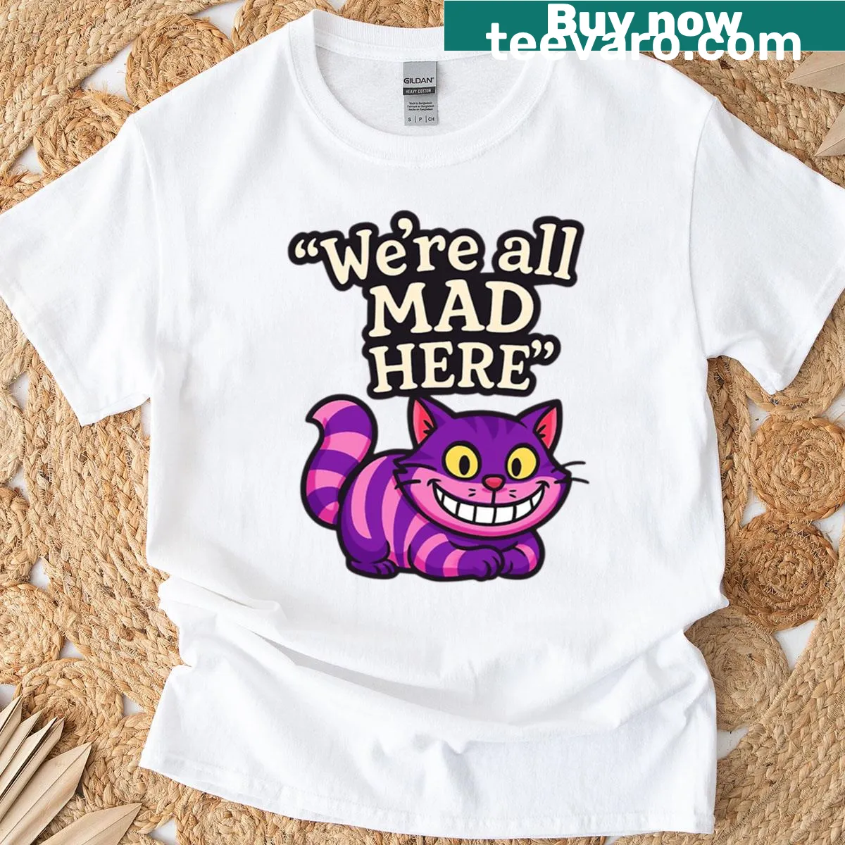 Whimsical quote t-shirt featuring the Cheshire Cat for book lovers. — on a men's t-shirt