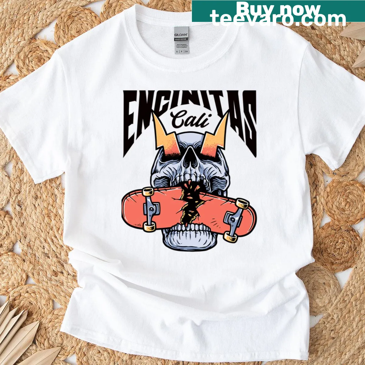Skateboarding-themed T-shirt featuring a skull graphic and black text design from Encinitas. — on a men's t-shirt