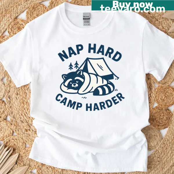 Cartoon raccoon lounging with text 'Nap Hard Camp Harder' on t-shirt