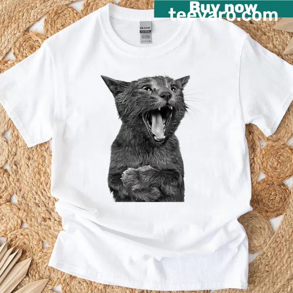 Surreal photo collage T-shirt featuring a screaming cat and a giant pill.
