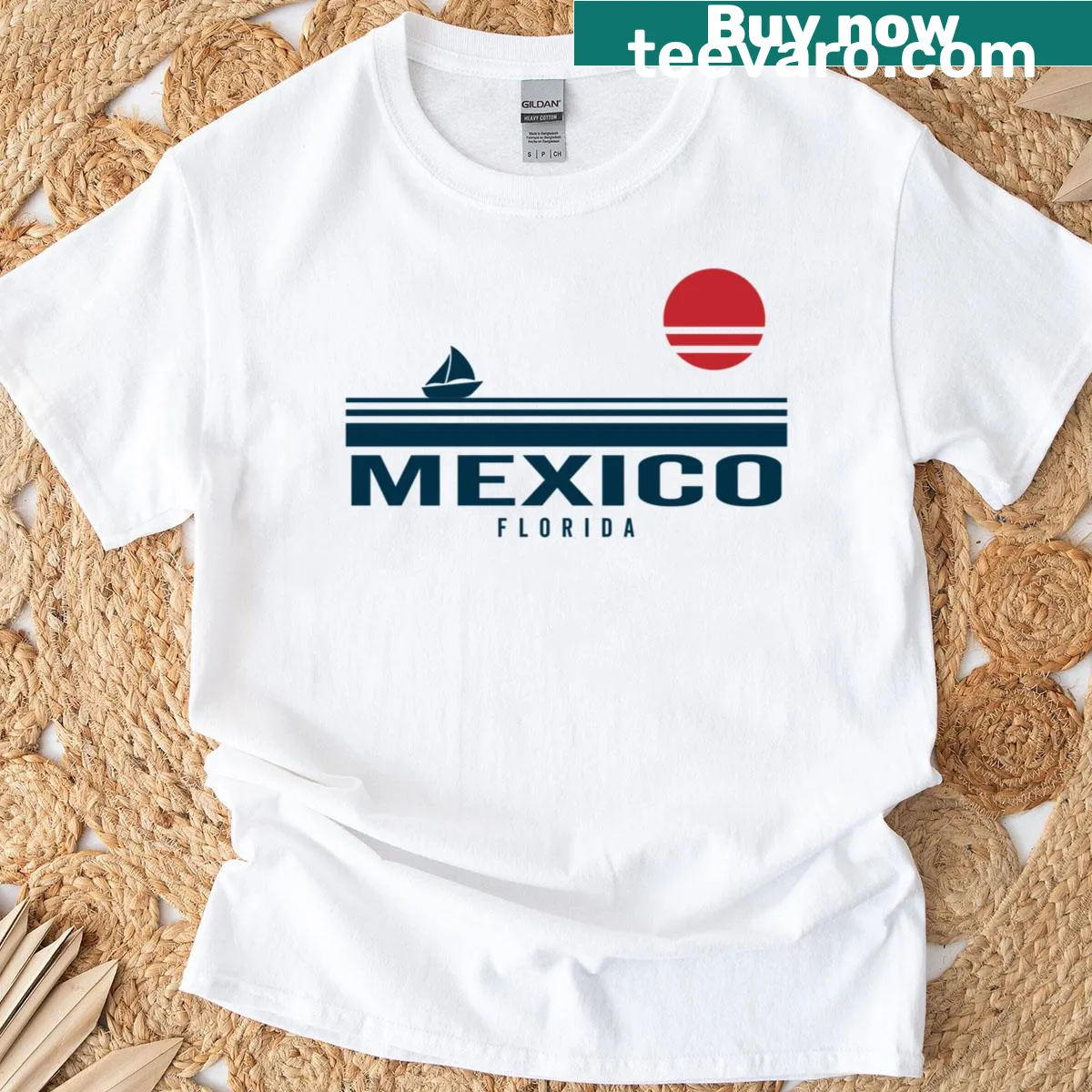 T-shirt featuring a sailboat against a sunset illustration — on a men's t-shirt