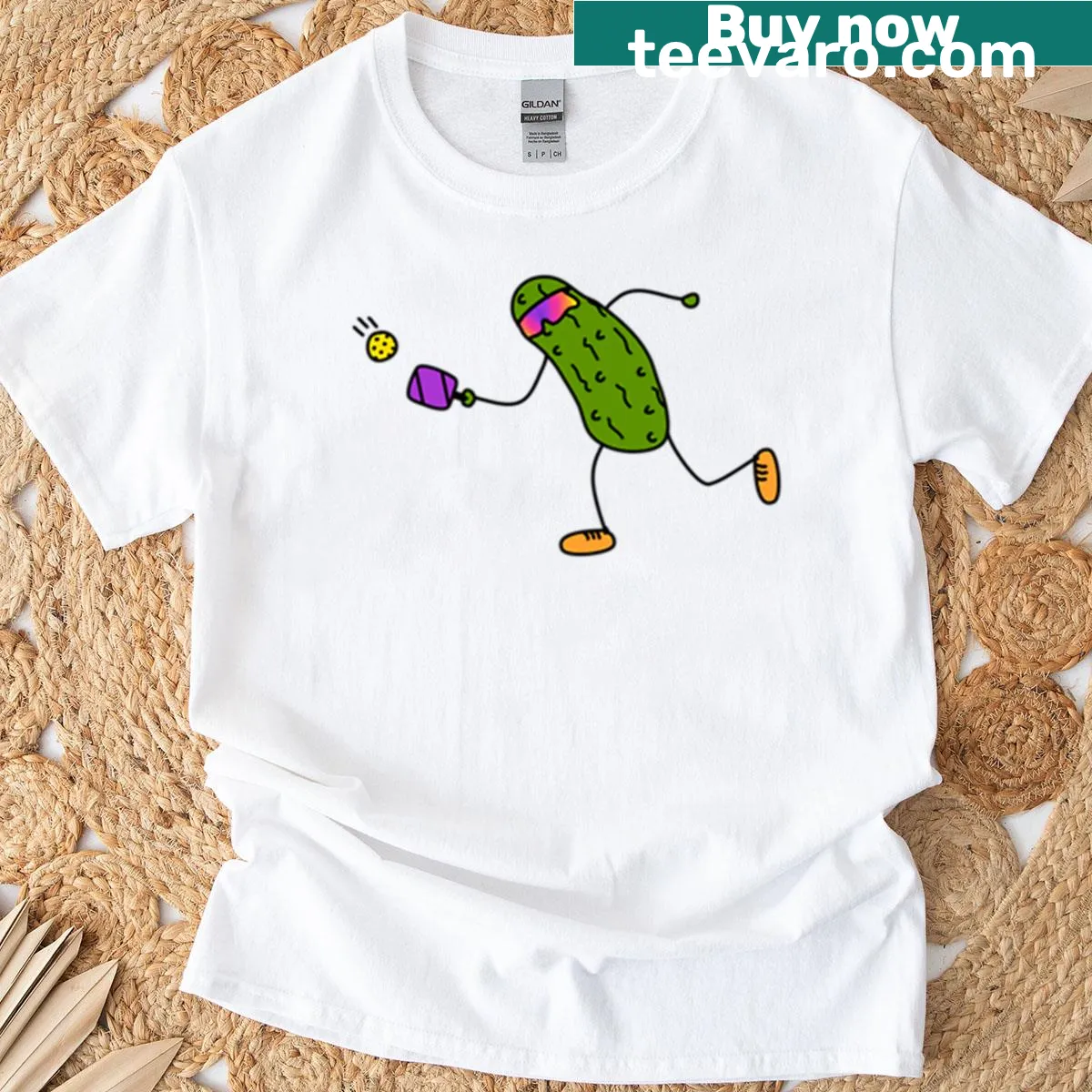 Cartoon pickle playing pickleball in a playful design — on a men's t-shirt