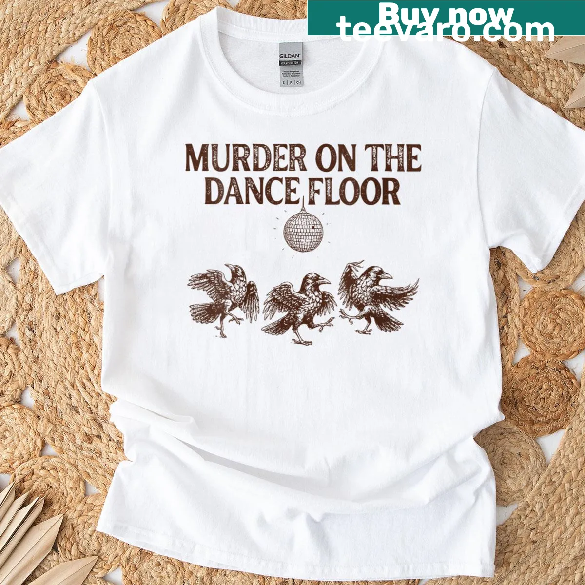 Witchy crow graphic T-shirt inspired by dark academia and spooky themes — on a men's t-shirt