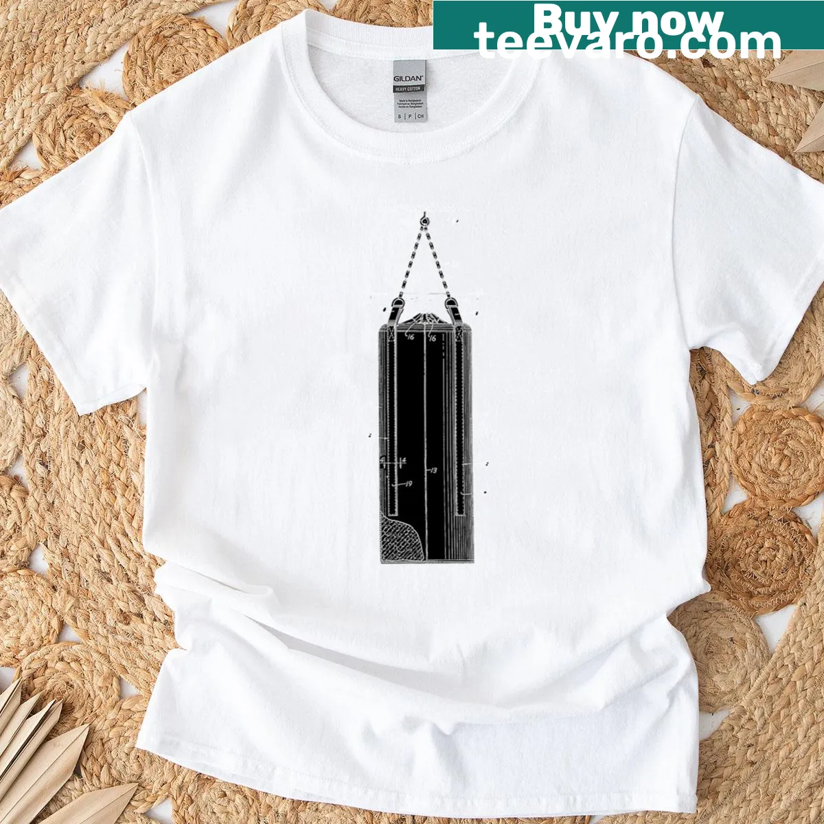 Minimalist T-shirt featuring patent illustration of a punching bag — on a men's t-shirt