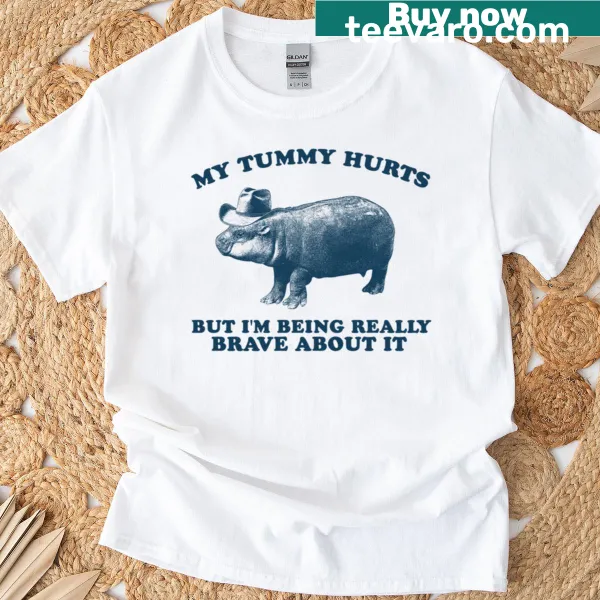 Funny T-shirt with a cartoon hippo about bravery and tummy aches