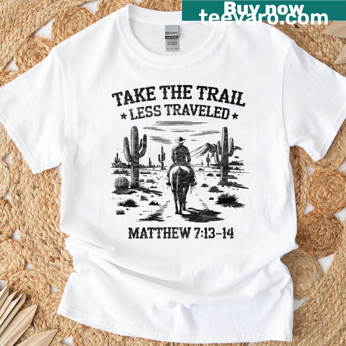 Western-themed 'Take The Trail Less Traveled' t-shirt with bold typography — on a men's t-shirt