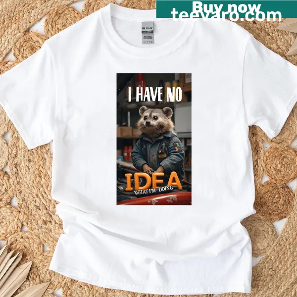 Cute T-shirt featuring a baby raccoon as a mechanic