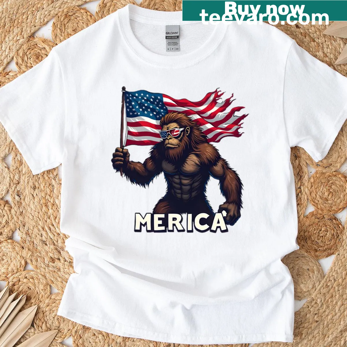 Funny cartoon Bigfoot holding an American flag on a T-shirt — on a men's t-shirt