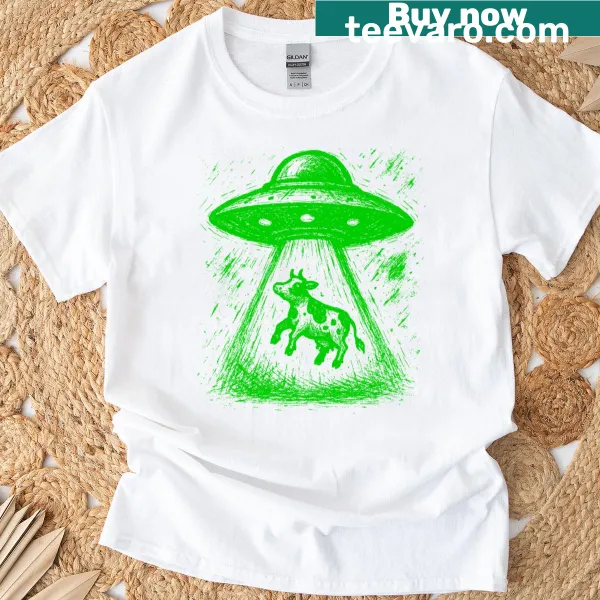 Green t-shirt featuring a whimsical UFO milk design.