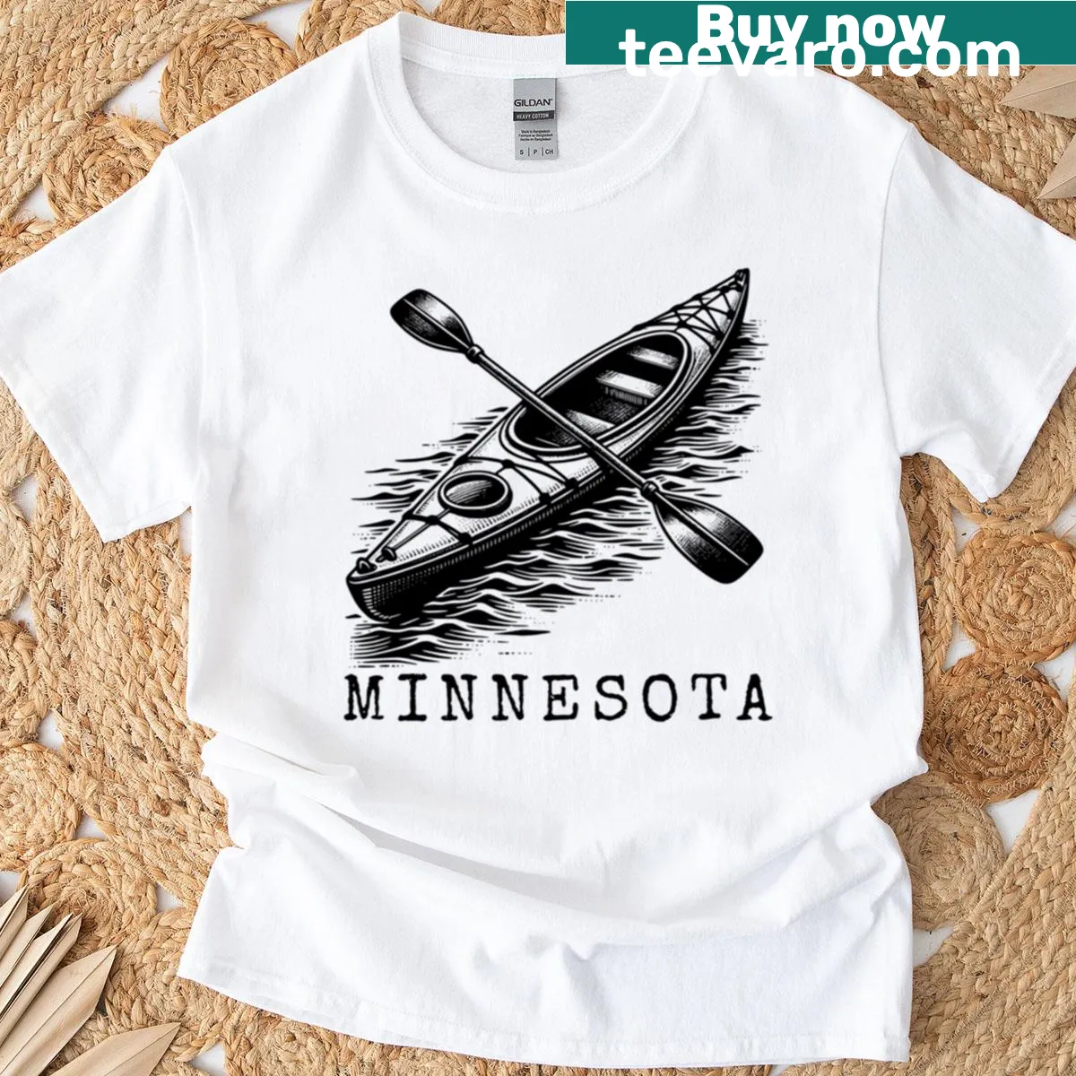 Minnesota kayak badge t-shirt featuring a kayak graphic and text — on a men's t-shirt