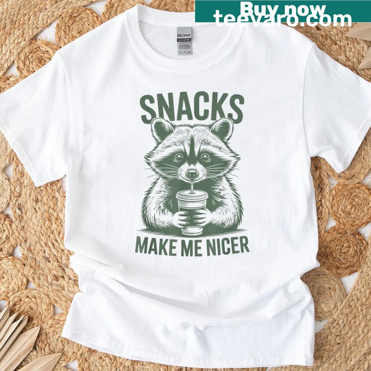 Funny saying tee with 'Snacks Make Me Nicer' raccoon design — on a men's t-shirt
