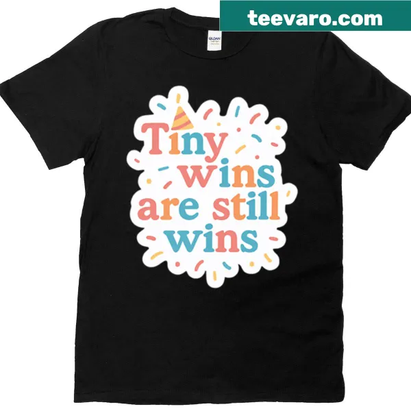 Motivational text about tiny wins on a casual t-shirt