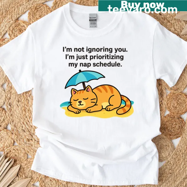 Cartoon cat napping on the beach T-shirt