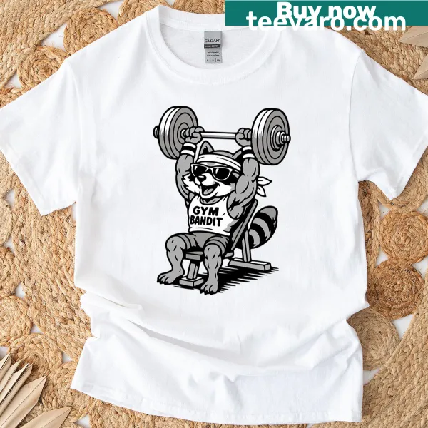 Funny t-shirt with a cartoon buff raccoon lifting weights