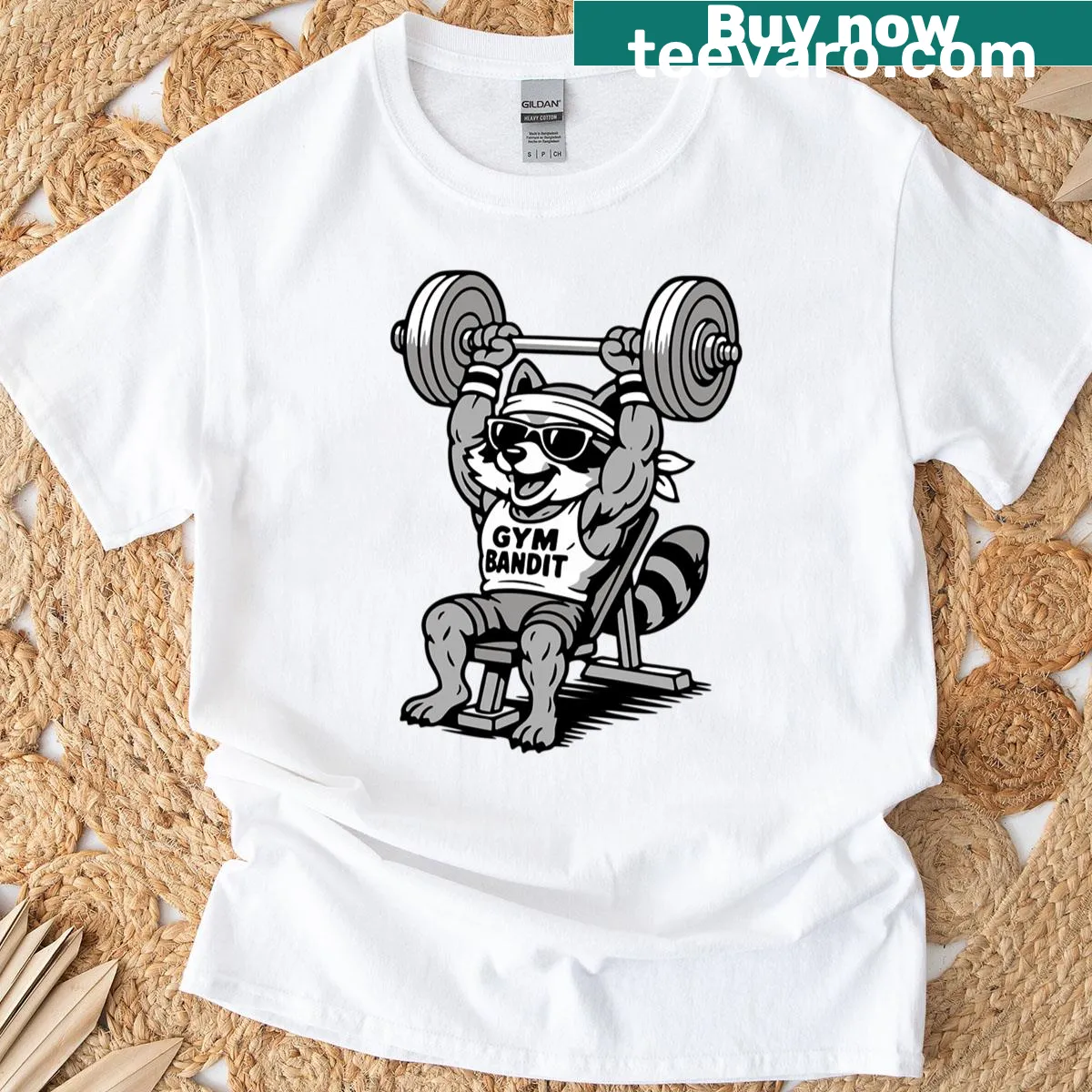 Funny t-shirt with a cartoon buff raccoon lifting weights — on a men's t-shirt