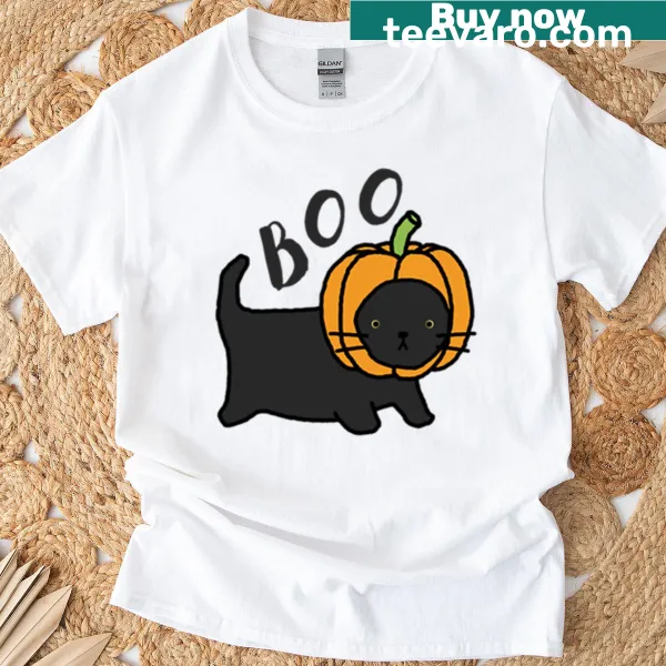 Cute black cat peeking from a pumpkin on an oversized t-shirt