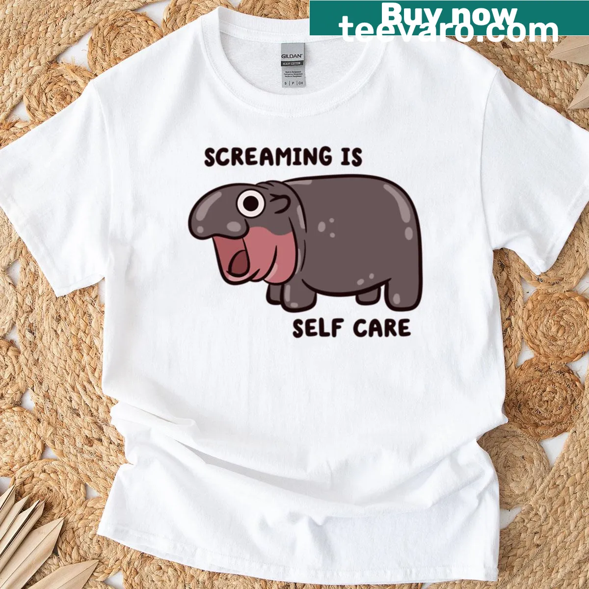 Pygmy hippo graphic t-shirt with self-care message — on a men's t-shirt