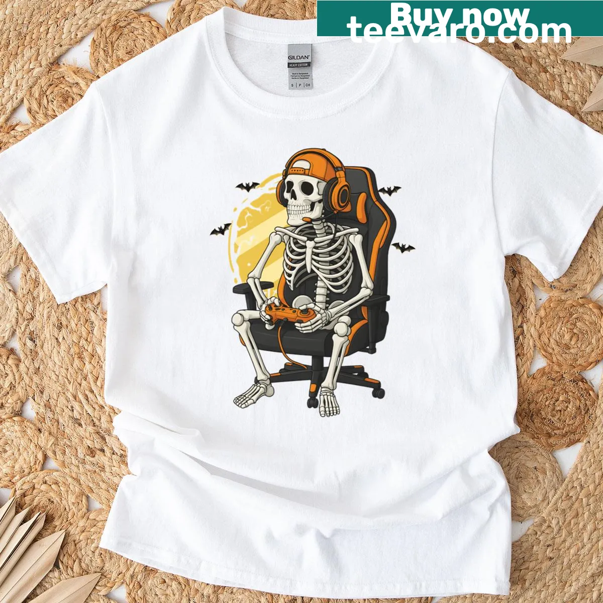 Skeleton in a gaming setup with a controller for Halloween. — on a men's t-shirt