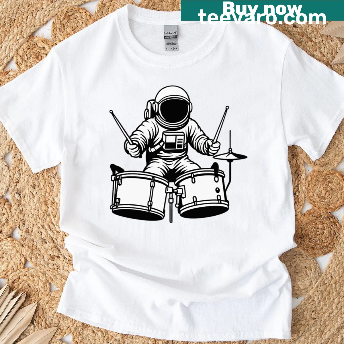 Illustrated t-shirt featuring an astronaut playing drums in space — on a men's t-shirt