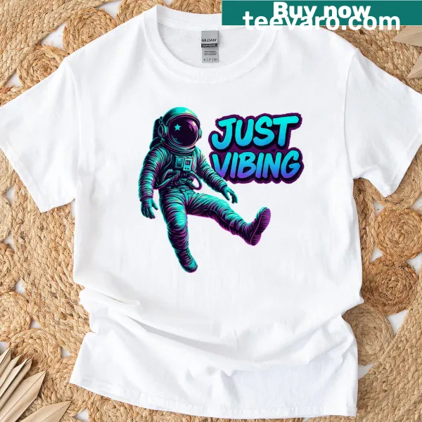 Whimsical astronaut T-shirt in purple and teal colors
