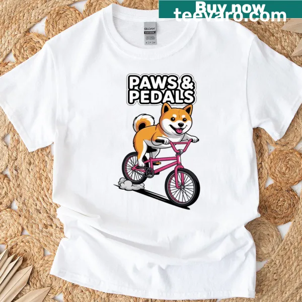 Illustrated Shiba Inu riding a bicycle on a t-shirt
