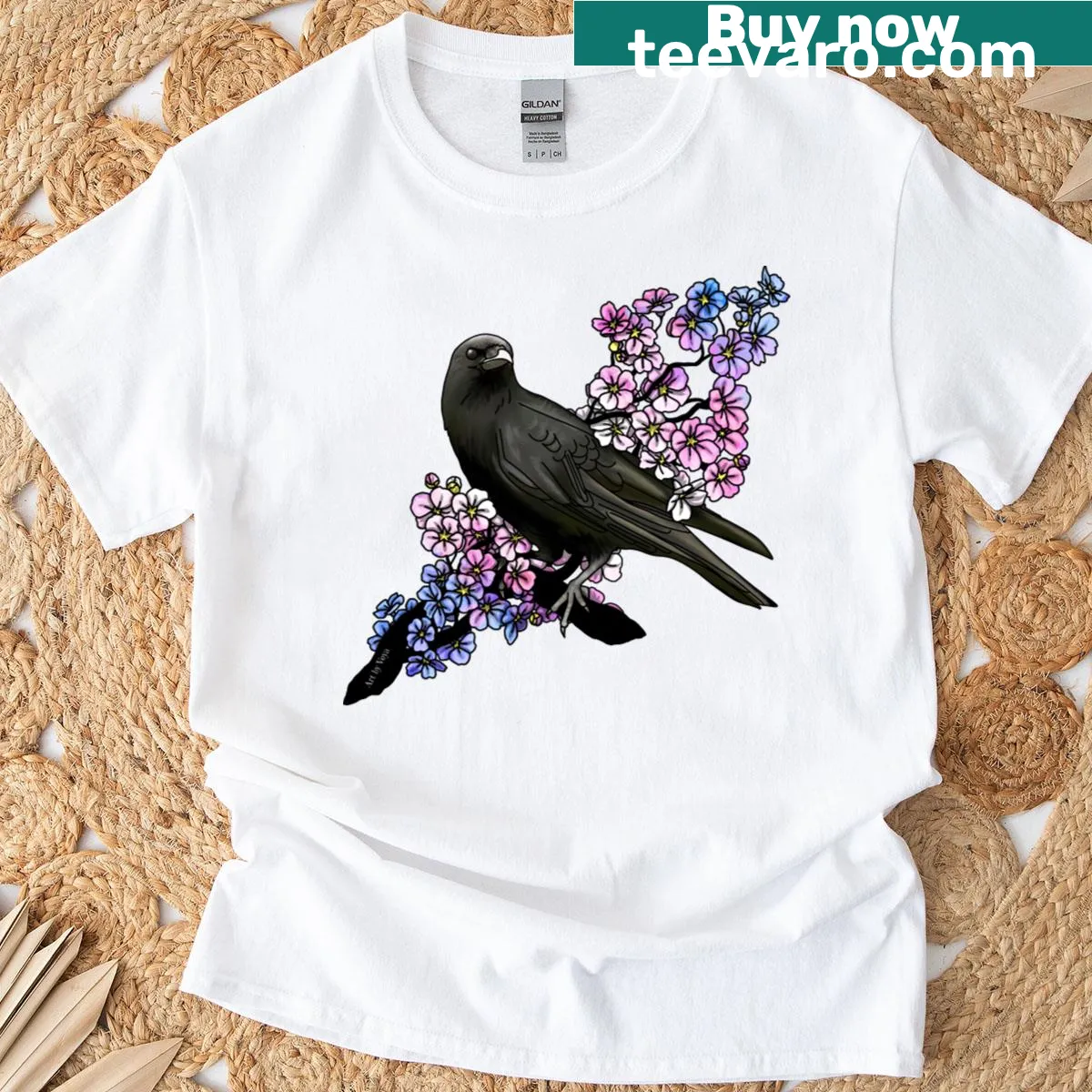 Illustrated crow design on a T-shirt representing trans pride — on a men's t-shirt