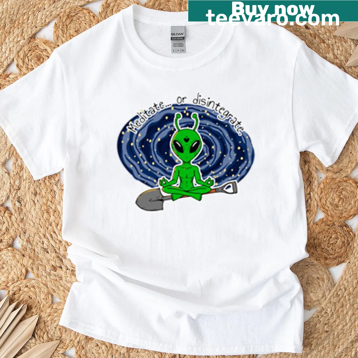 Whimsical alien meditation graphic t-shirt — on a men's t-shirt