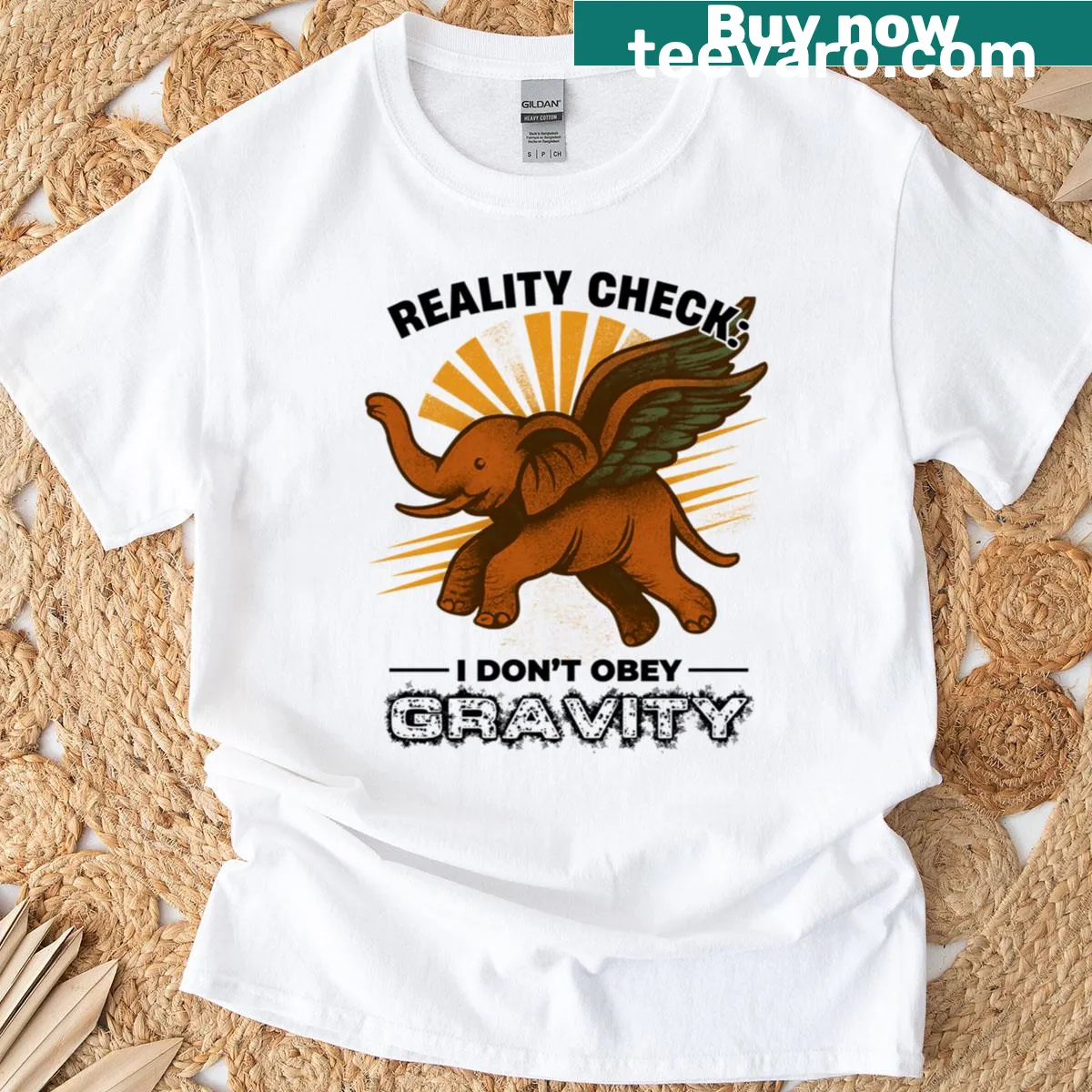 Flying elephant graphic with the phrase 'I Don’t Obey Gravity' on T-shirt — on a men's t-shirt