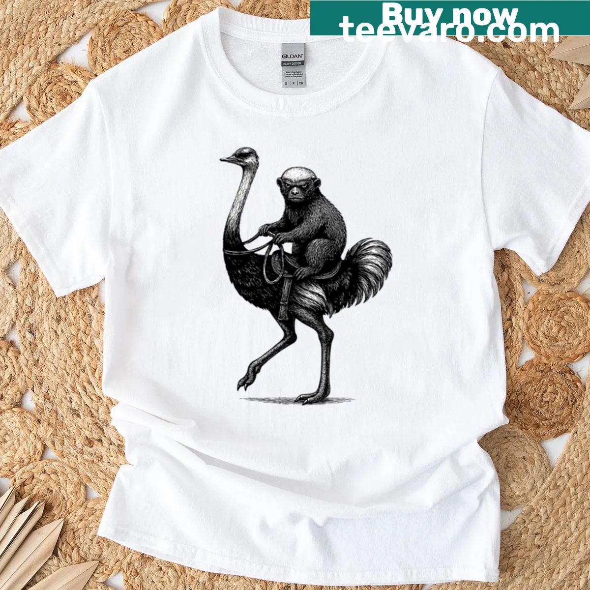 Cartoon graphic T-shirt of a honey badger riding an ostrich — on a men's t-shirt