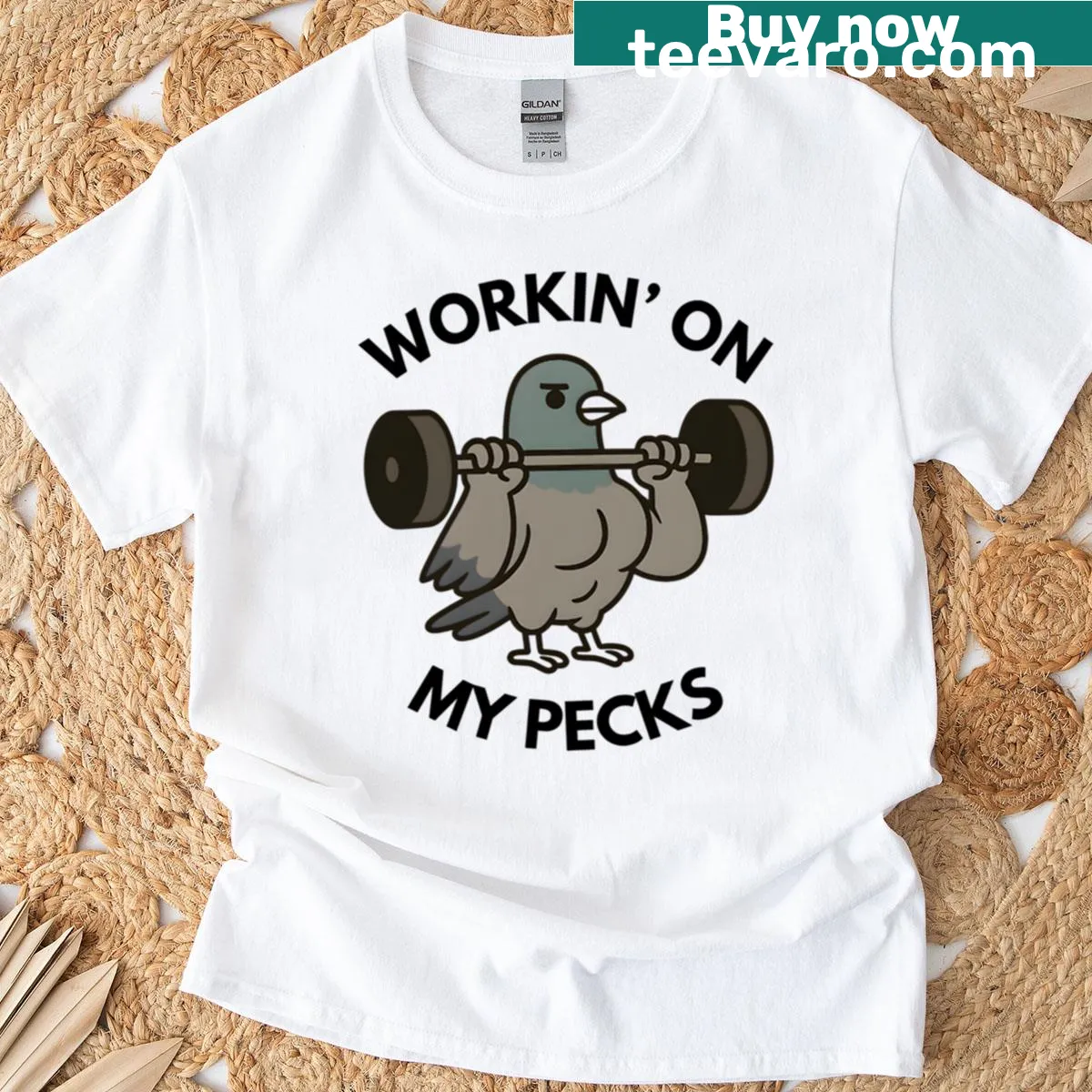 Humorous t-shirt with a muscular pigeon design — on a men's t-shirt