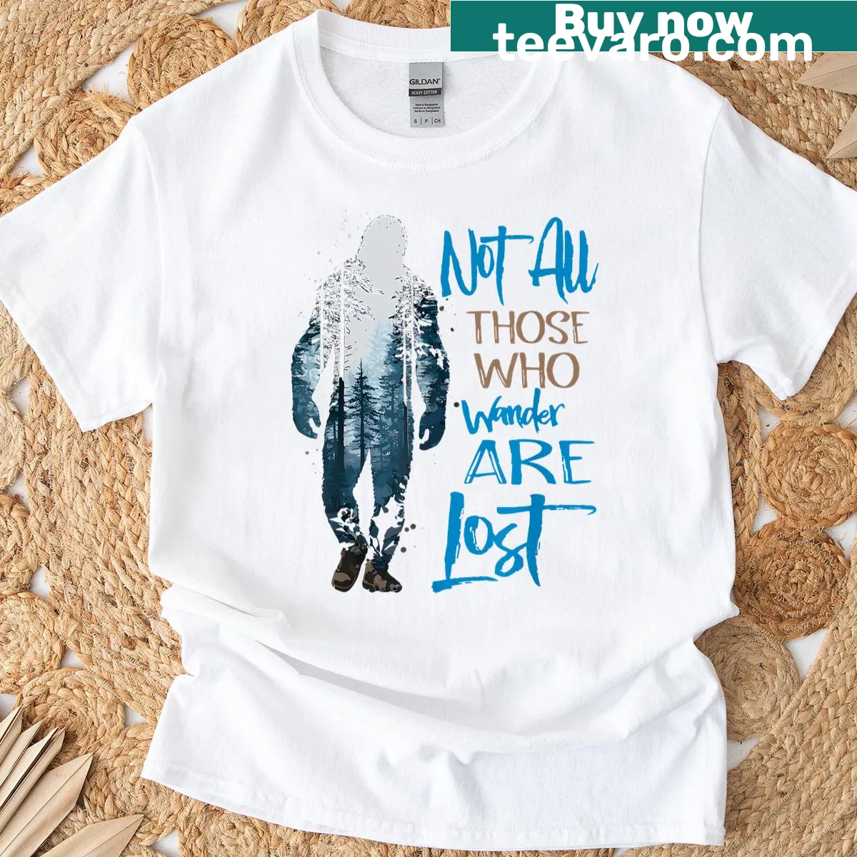 Whimsical Bigfoot graphic t-shirt with adventure quote — on a men's t-shirt