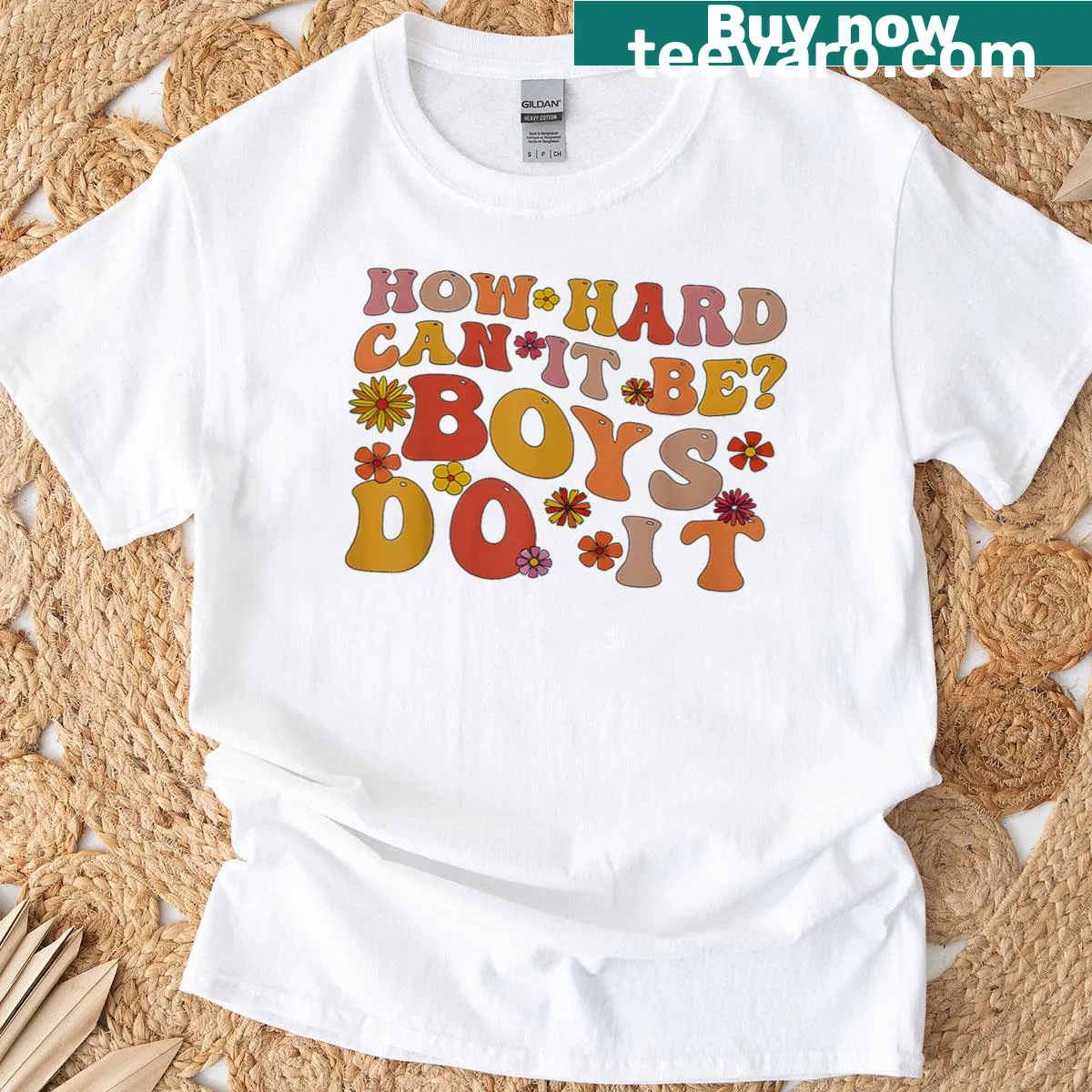 T-shirt with the inspirational quote 'How Hard Can It Be? Boys Do It' in a groovy font — on a men's t-shirt