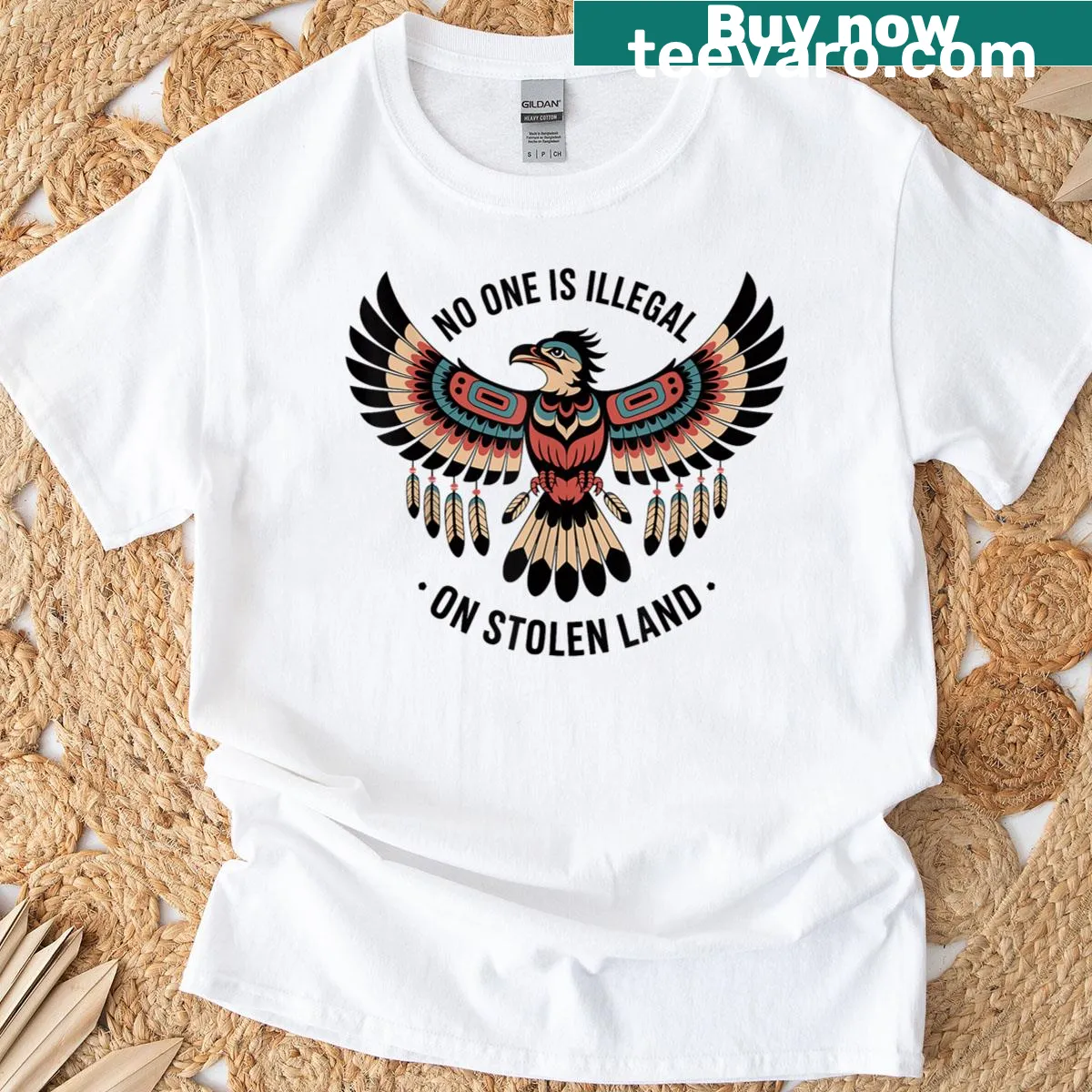 Thunderbird graphic T-shirt with the phrase about stolen land rights — on a men's t-shirt