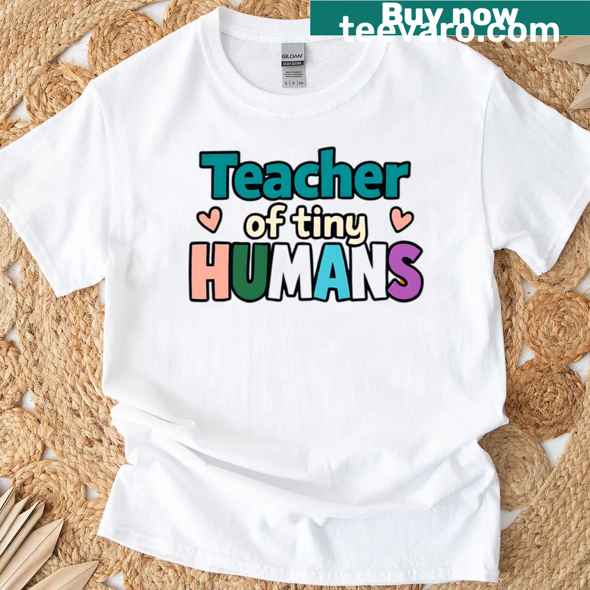 T-shirt with the text 'Teacher Of Tiny Humans' in a cheerful design. — on a men's t-shirt