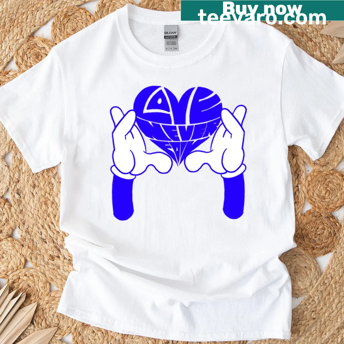Heart calligram design with the phrase 'Love Never Fails' — on a men's t-shirt