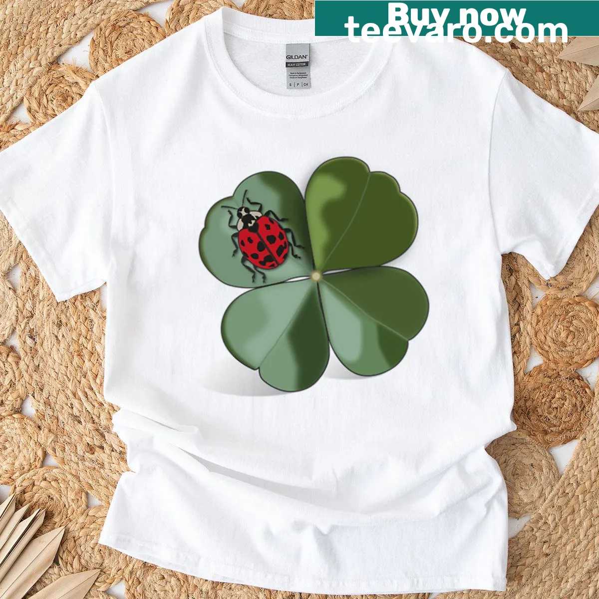 Illustration of a ladybird on a four-leaf clover symbolizing luck — on a men's t-shirt