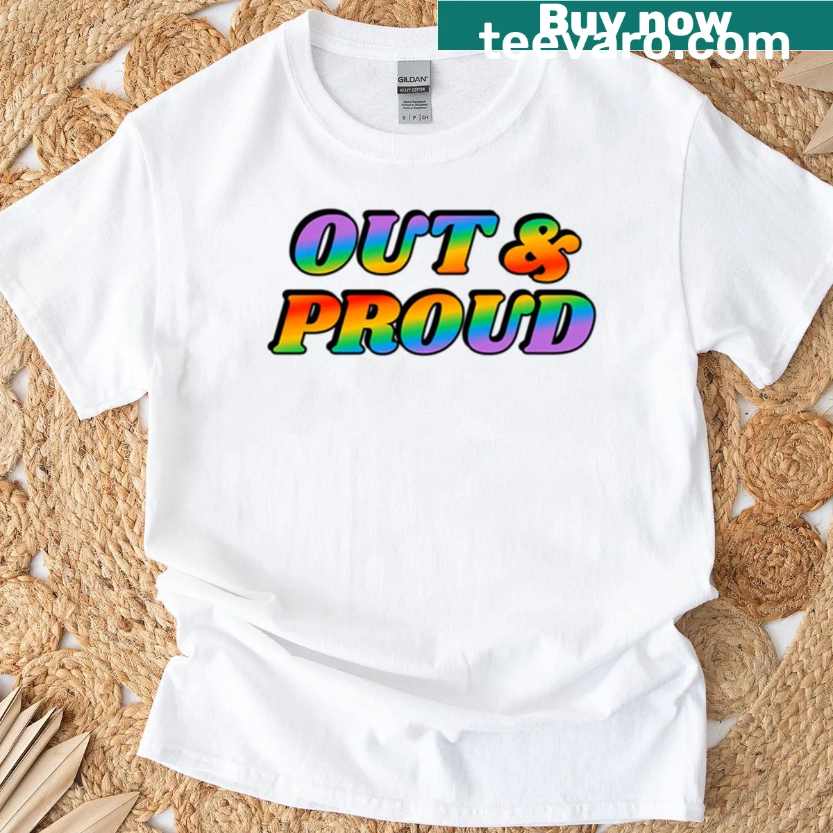 Rainbow text saying Out And Proud on T-shirt — on a men's t-shirt