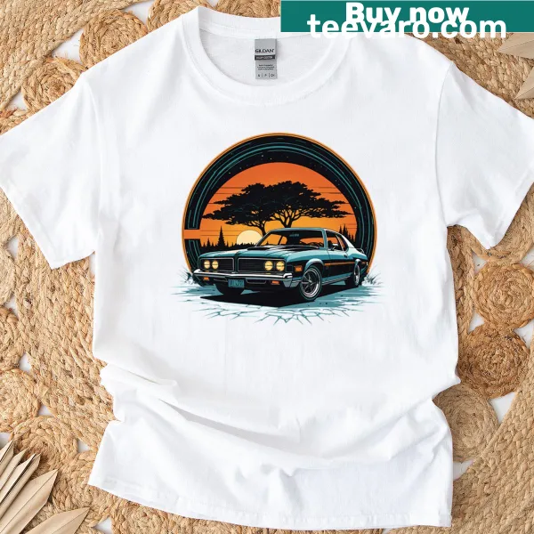 Muscle car illustration against a sunset background on a T-shirt.