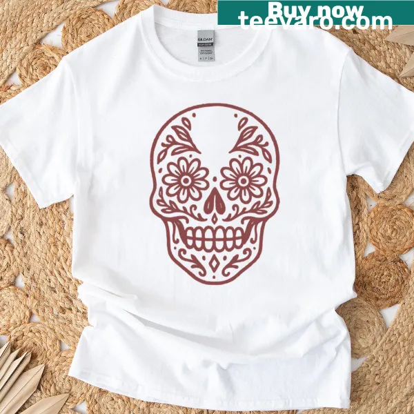 Intricate sugar skull and floral design on a T-shirt