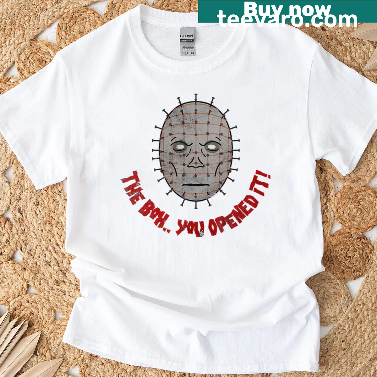 Vintage-style T-shirt featuring a distressed graphic of Pinhead — on a men's t-shirt