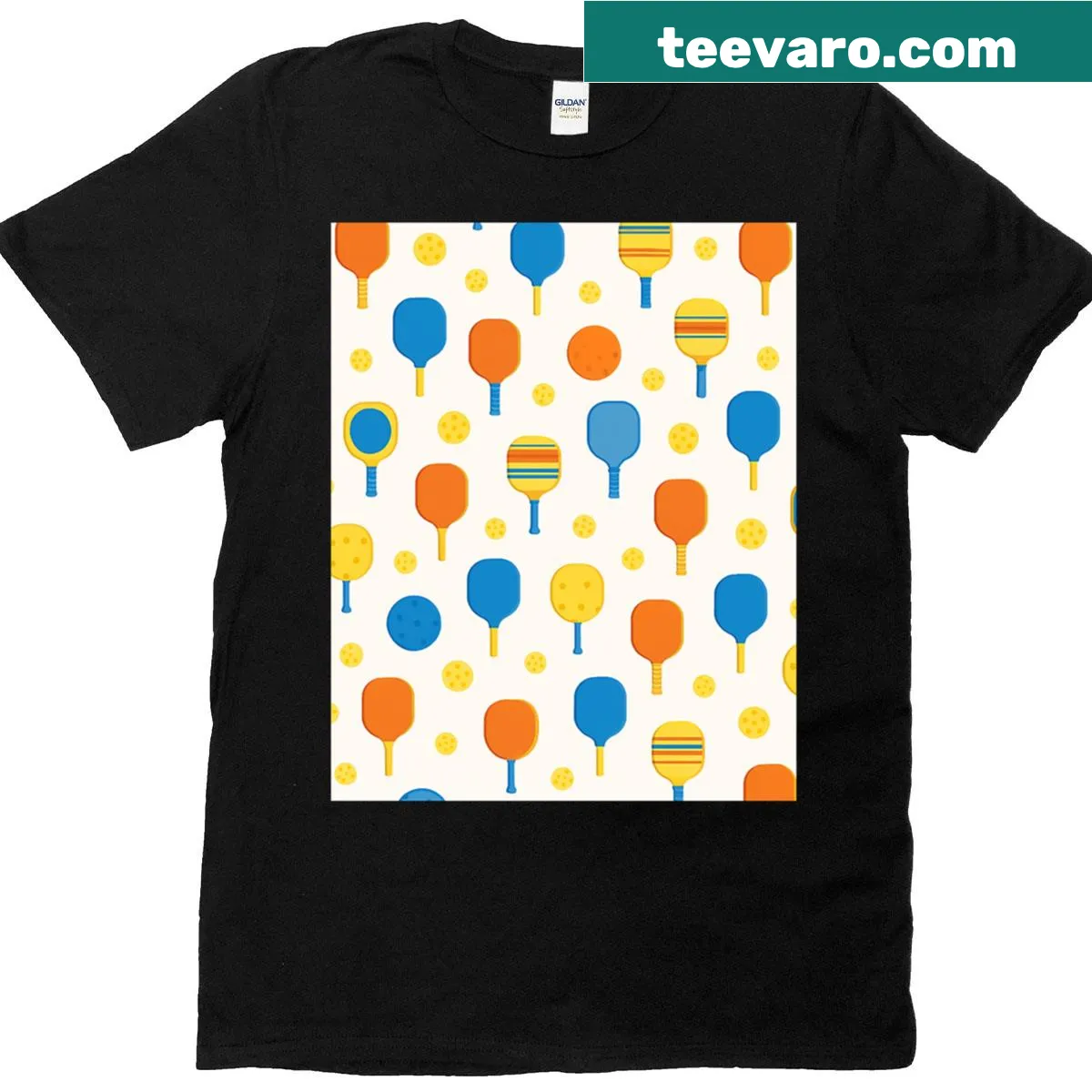Graphic T-shirt with playful pickleball paddles and balls pattern — on a men's t-shirt
