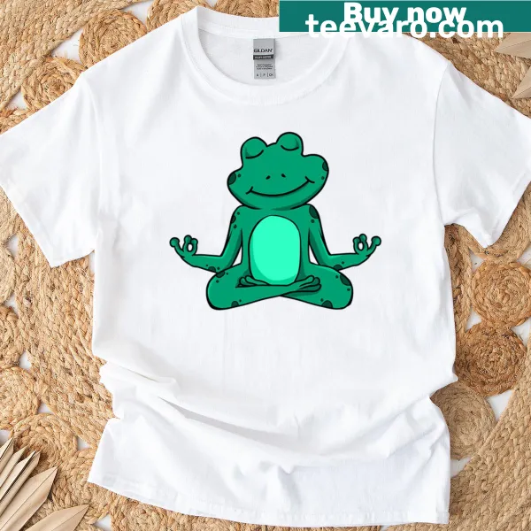 Cartoon T-shirt showing a teal frog meditating in yoga pose