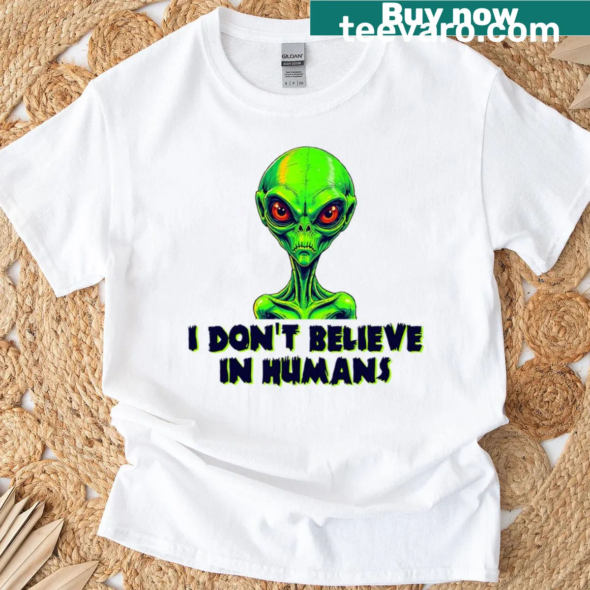 Alien graphic t-shirt with humorous text about humans — on a men's t-shirt
