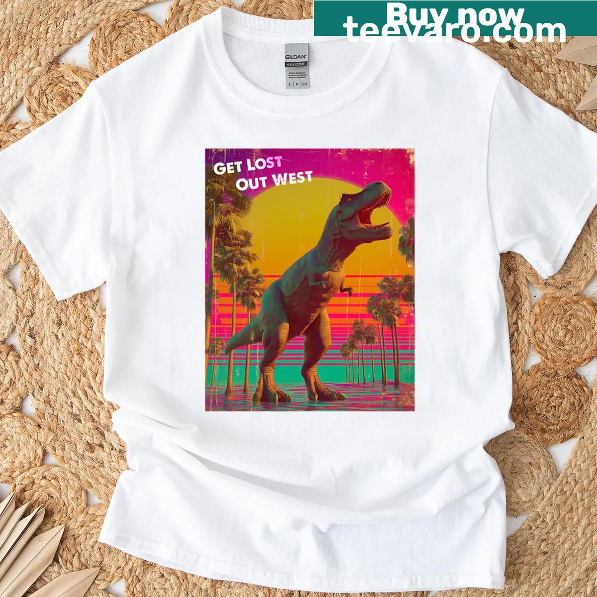 Illustrated T-shirt featuring a roaring T-rex in a Wild West setting — on a men's t-shirt