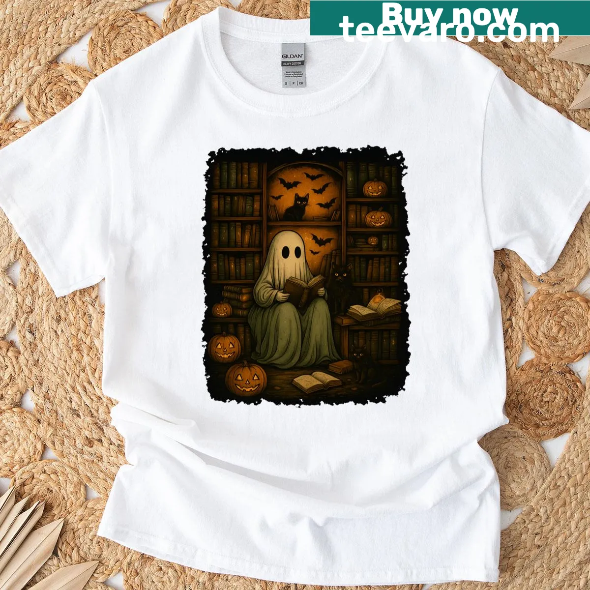 Illustrated T-shirt featuring a ghost reading in a haunted library with cats — on a men's t-shirt