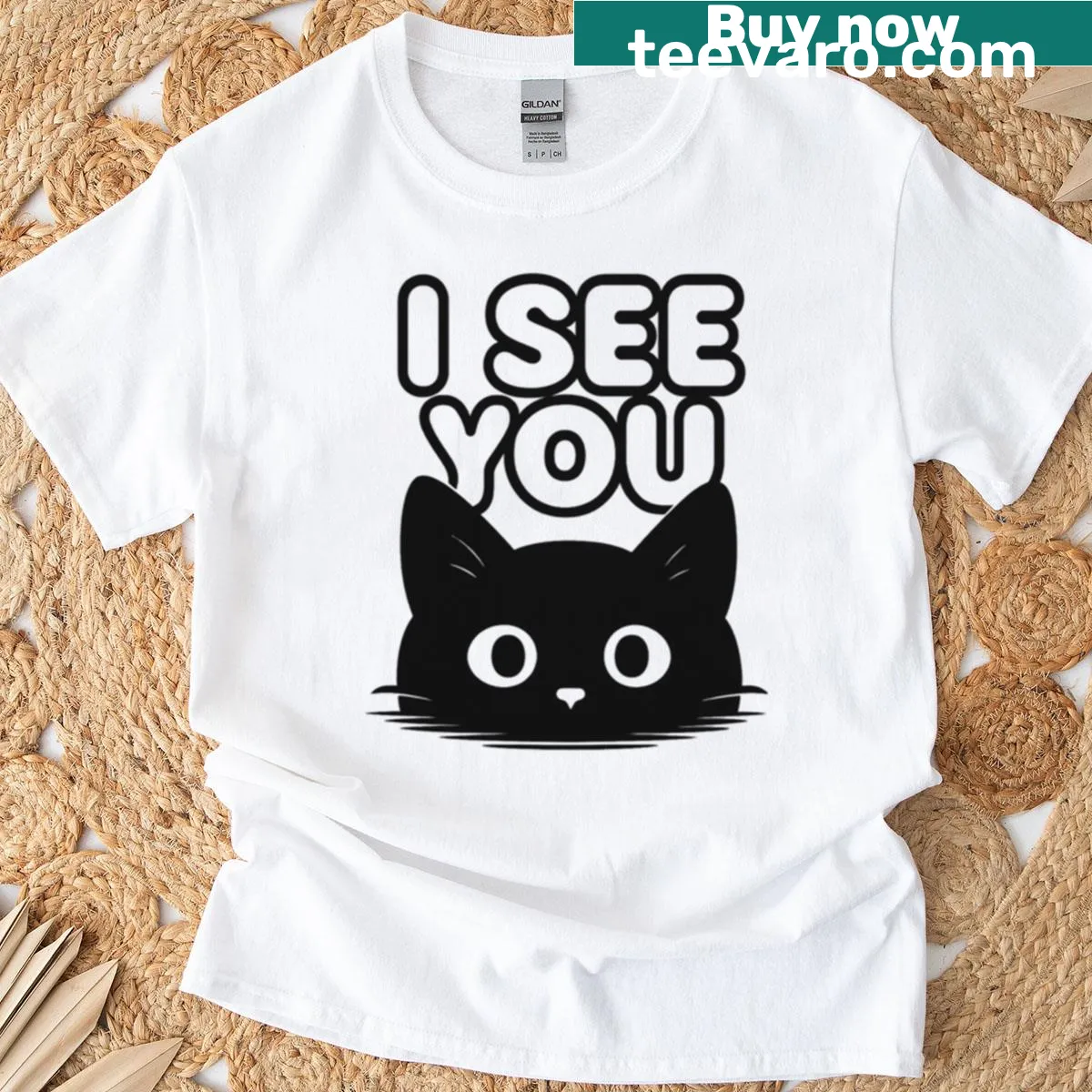 Cute black cat t-shirt featuring illustrated watching eyes. — on a men's t-shirt